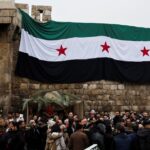 Christians protest as foreign fighters burn down Christmas Tree in Syria